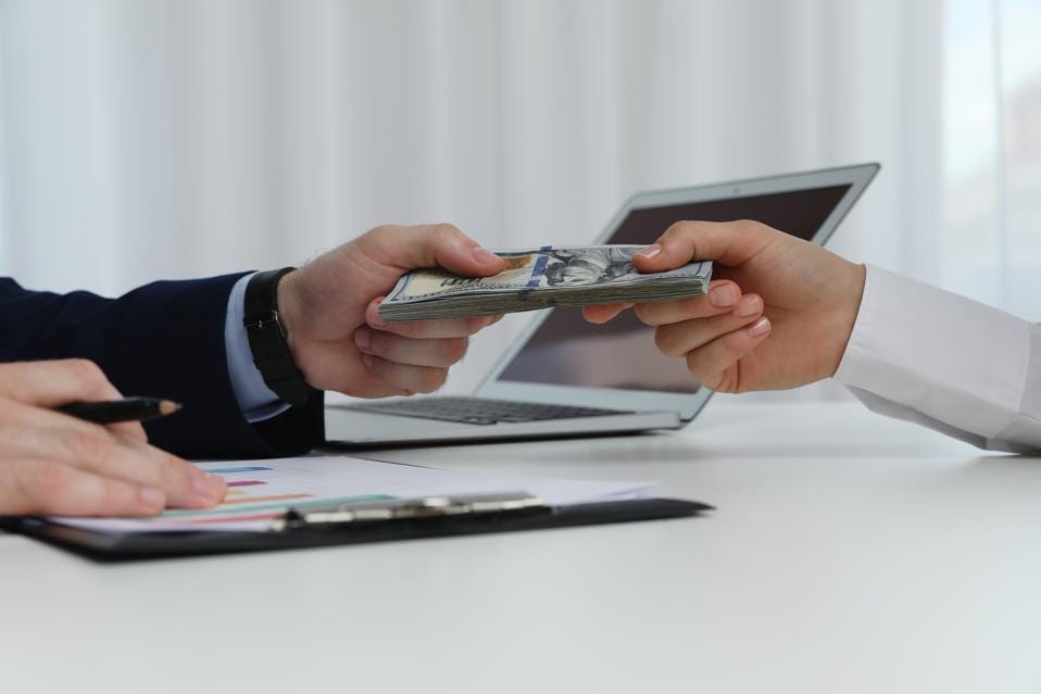 Exchanging Money between hands at desk