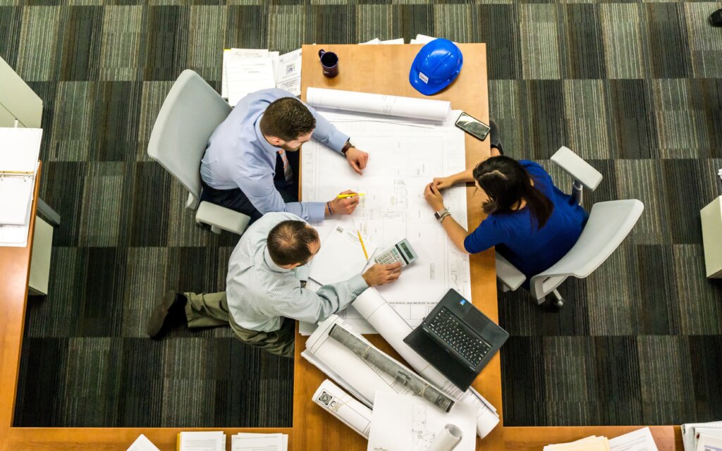 staffing firm employees sitting at a conference room table